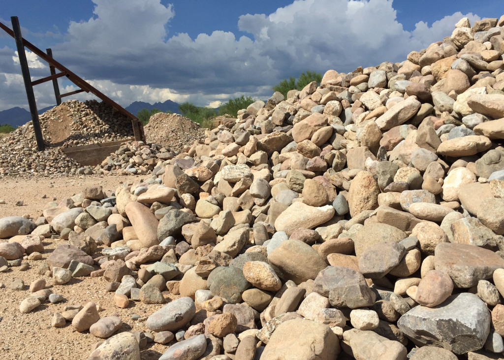 4-12TUMB Pantano River Rock stockpile showing the wide size range, and the screening grizzly. 